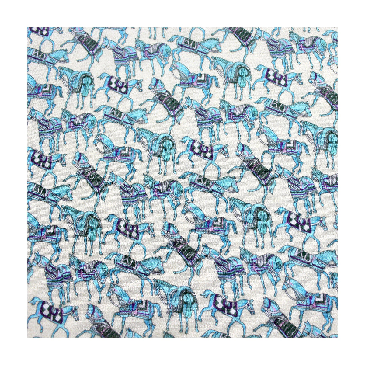 Blue horse print silk crepe fabric flat lay on white background