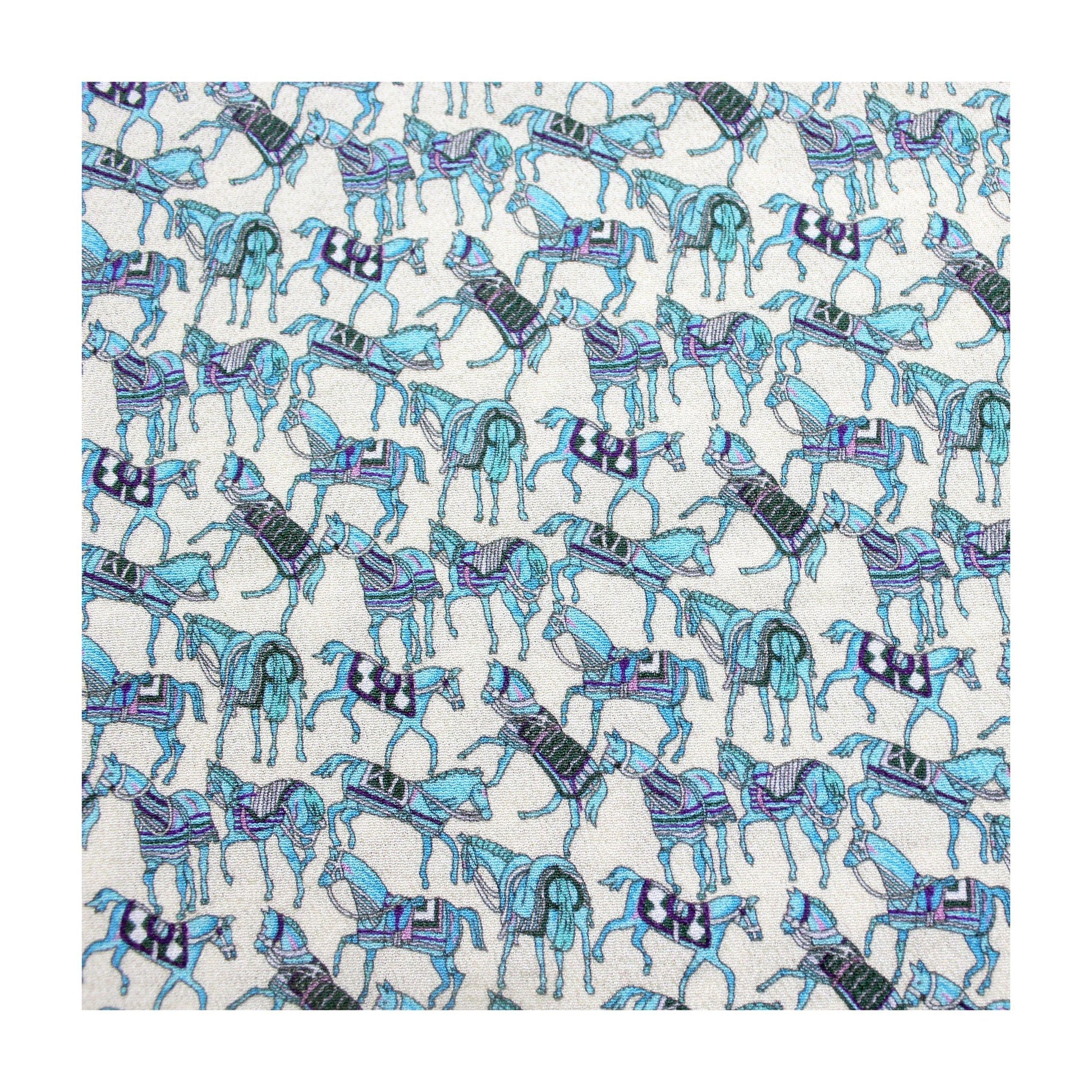 Blue horse print silk crepe fabric flat lay on white background