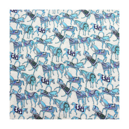 Blue horse print silk crepe fabric flat lay on white background