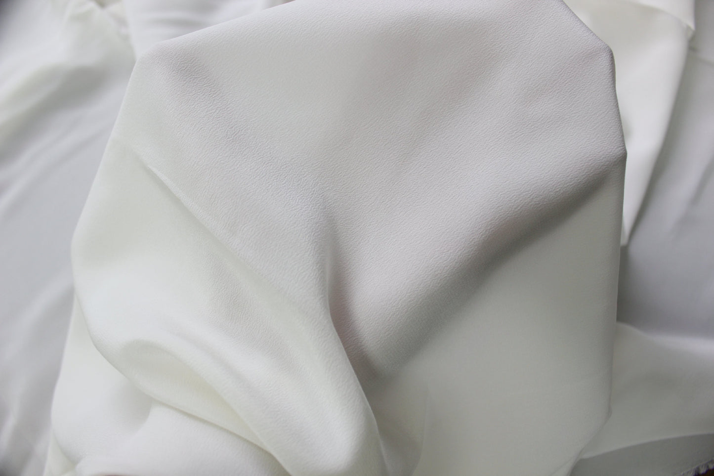 MingSilk 18 momme Crepe de Chine draped over a form to show its coverage, medium body and smooth fall.