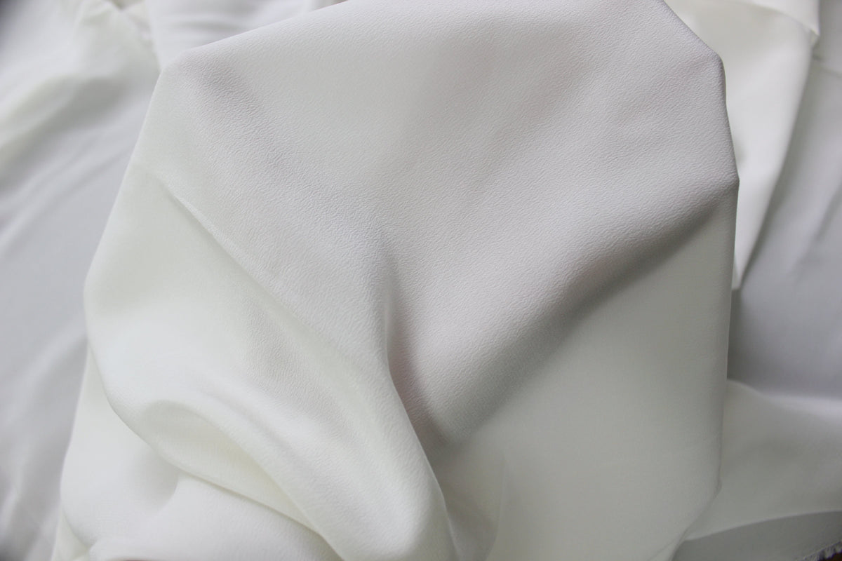 MingSilk 18 momme Crepe de Chine draped over a form to show its coverage, medium body and smooth fall.