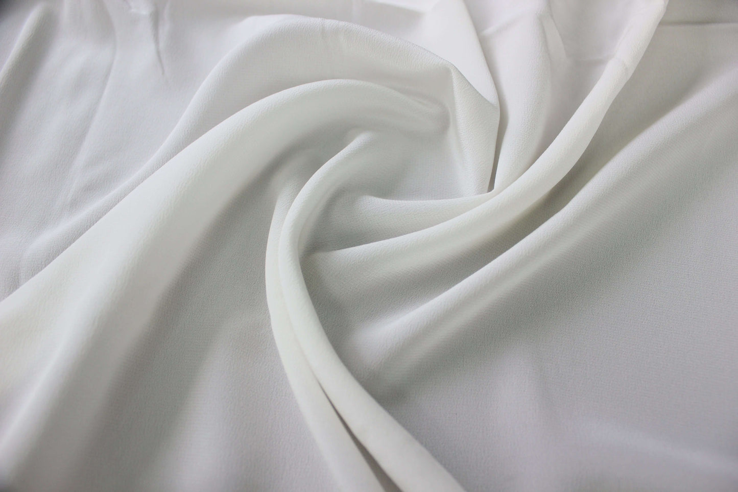 MingSilk 18 momme Crepe de Chine draped over a form to show its coverage, medium body and smooth fall.