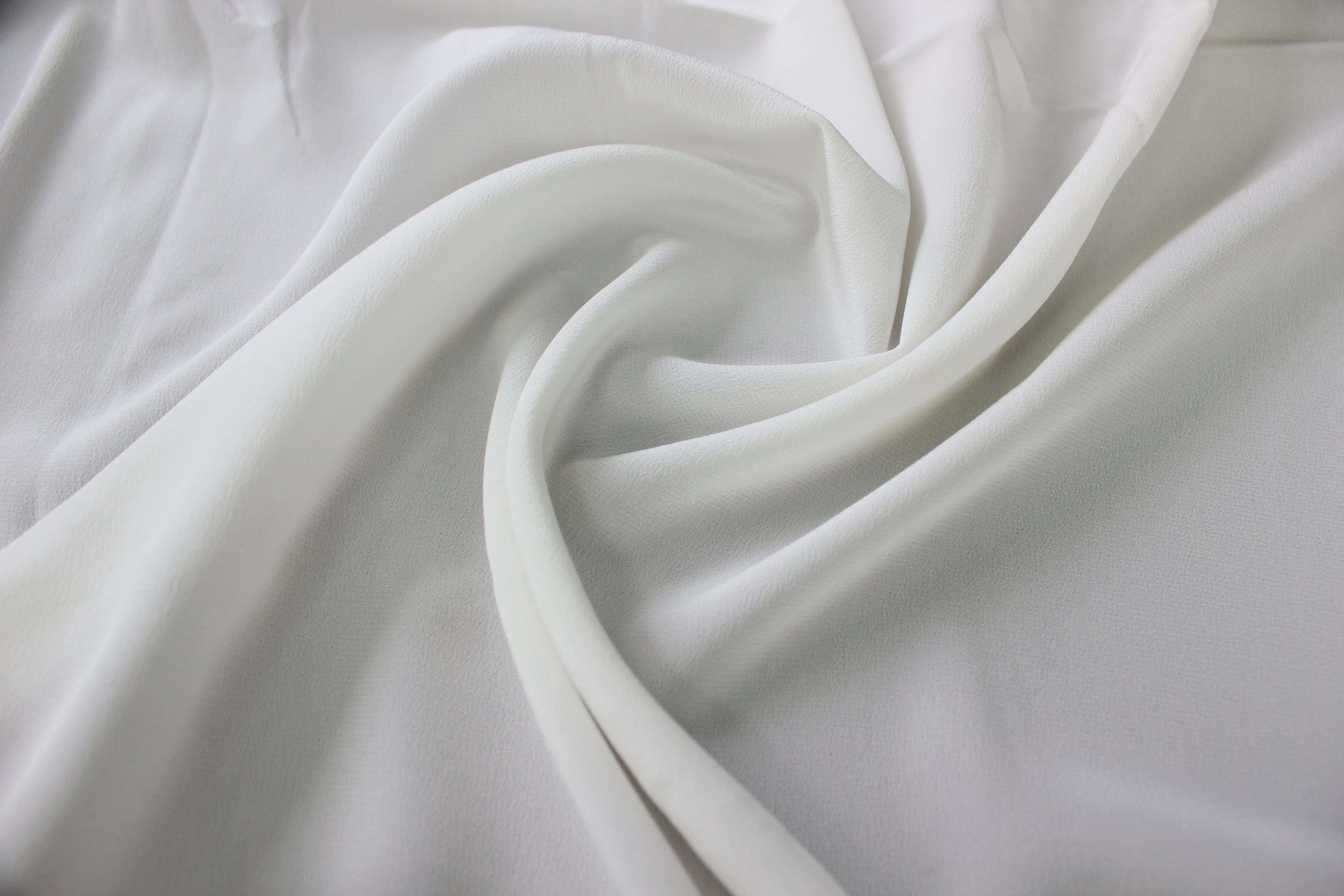 MingSilk 18 momme Crepe de Chine draped over a form to show its coverage, medium body and smooth fall.