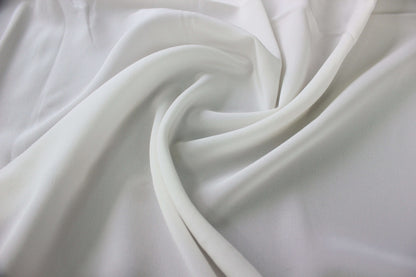 MingSilk 18 momme Crepe de Chine draped over a form to show its coverage, medium body and smooth fall.