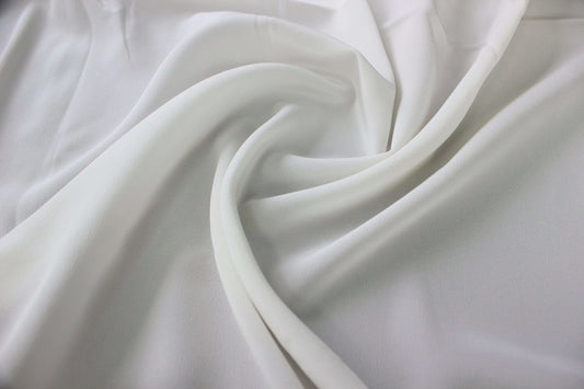 MingSilk 18 momme Crepe de Chine draped over a form to show its coverage, medium body and smooth fall.