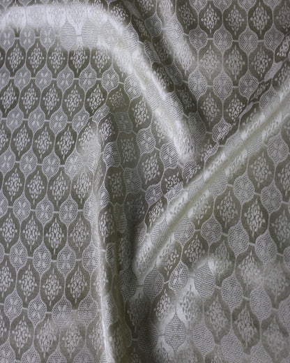 19 momme Sangbo jacquard satin fabric showing soft silk lustre across raised folds and woven motifs