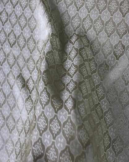 Close-up of Sangbo silk jacquard RH-2395 showing dimensional woven texture and changing satin highlights