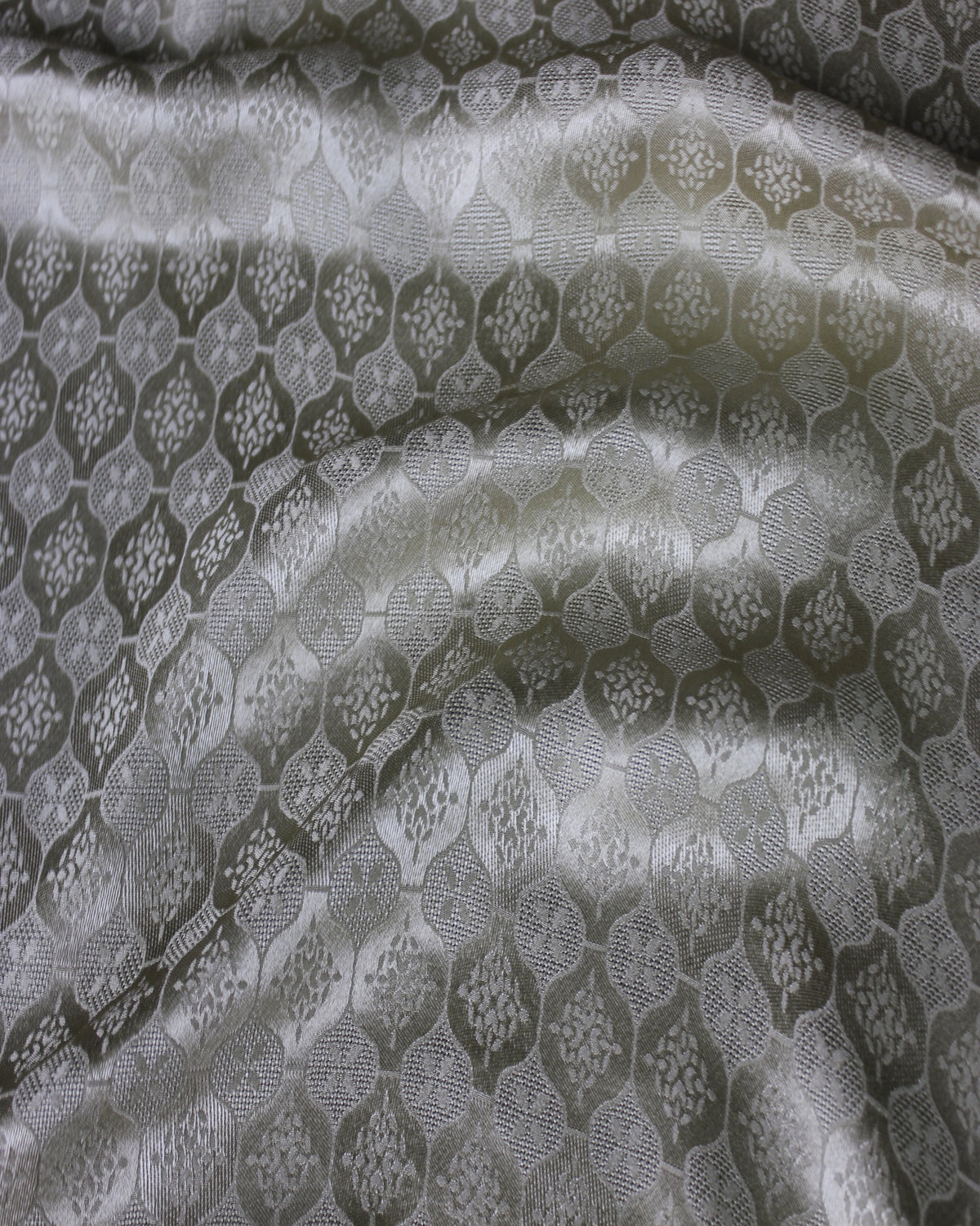 Mulberry silk Sangbo jacquard satin RH-2395 arranged in soft folds to show drape, sheen and woven pattern