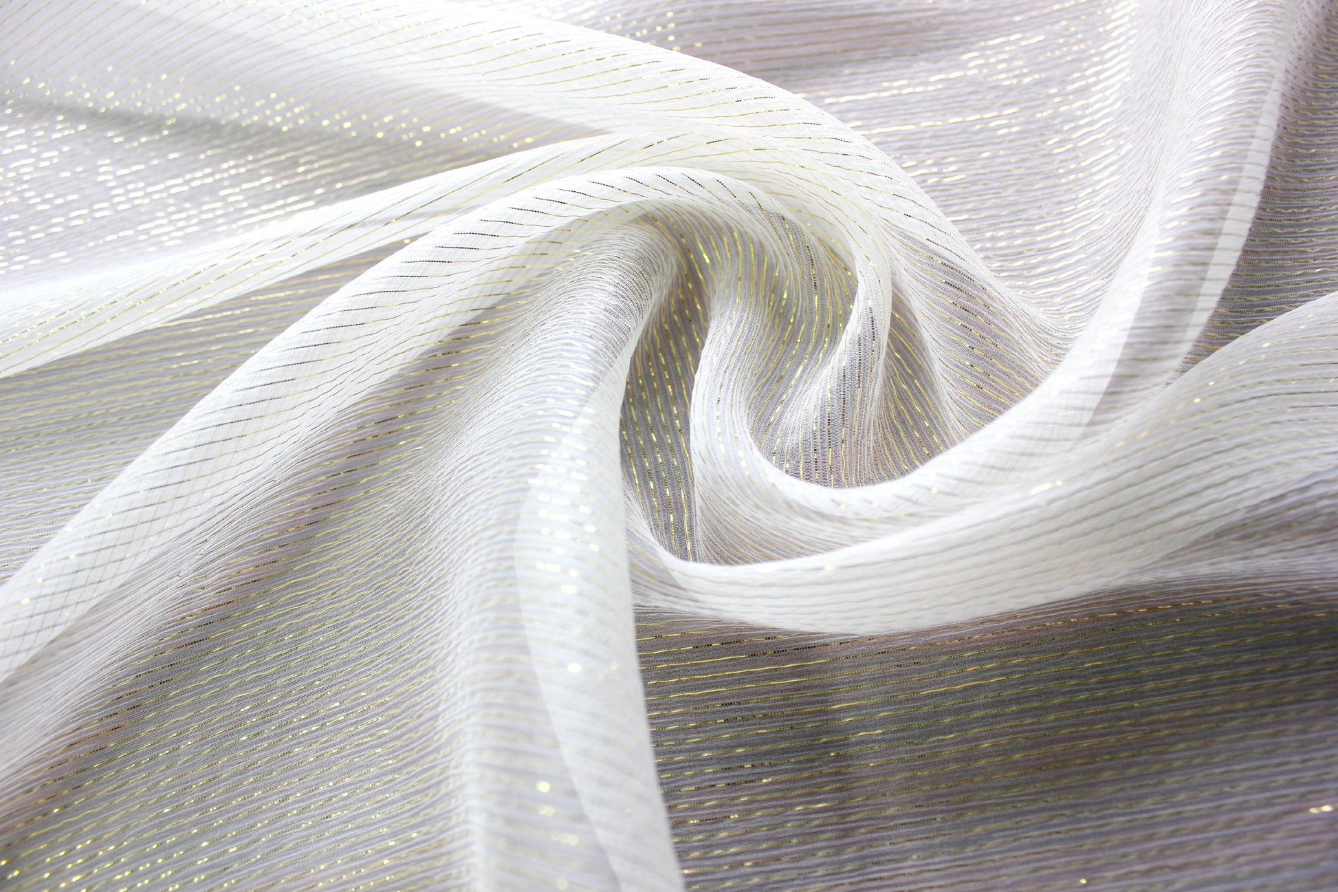 MingSilk 5.5 momme silk Yoryu fabric with fine gold-tone metallic stripes, sheer crinkle texture and fluid folds.