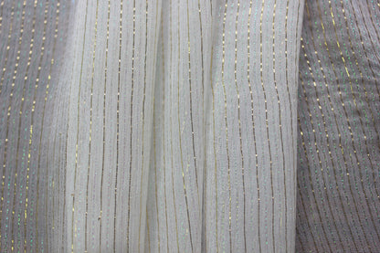 Sheer 6 momme MingSilk Yoryu silk shown against light and dark areas to demonstrate transparency.