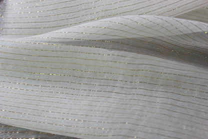 Layered 6 momme Yoryu sik showing semi-transparent construction, fine crinkles and metallic stripe details
