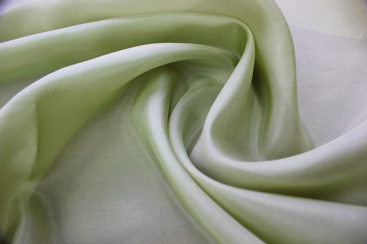 Flat view of light green 100% mulberry silk Habotai fabric surface