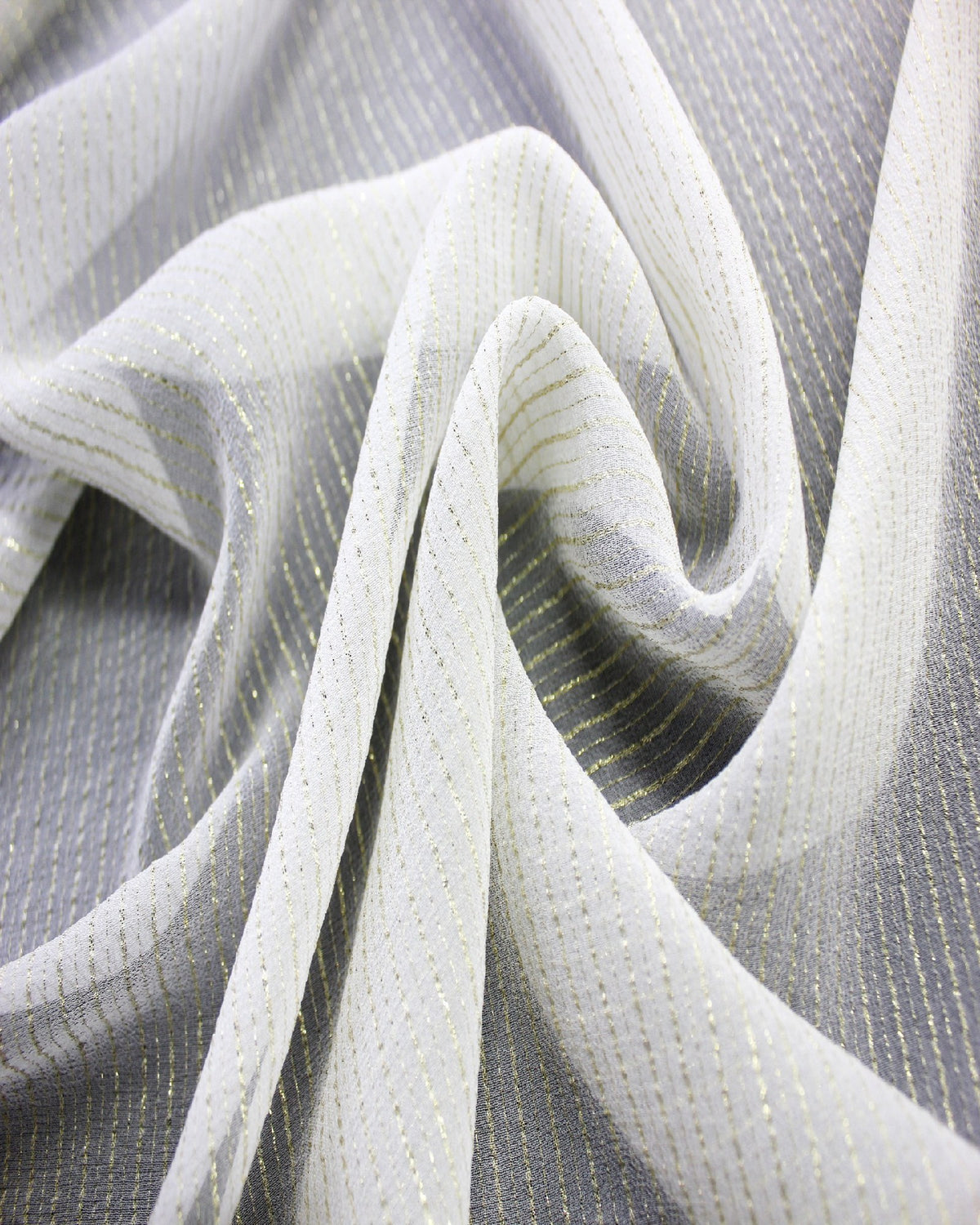 White gold-striped silk Yoryu arranged in flowing folds to show its lightweight hand, texture and graceful drape.
