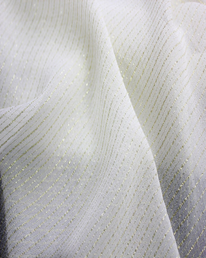 Close-up of 9 momme silk Yoryu showing fine parallel gold metallic stripes and a lightweight textured surface.