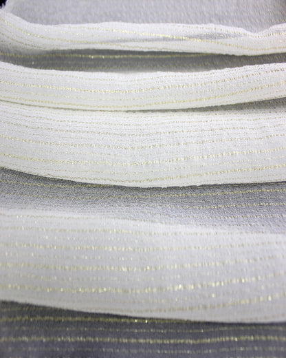 Layered white 9 momme silk Yoryu fabric showing gold metallic stripe spacing, lightweight body and layered opacity.