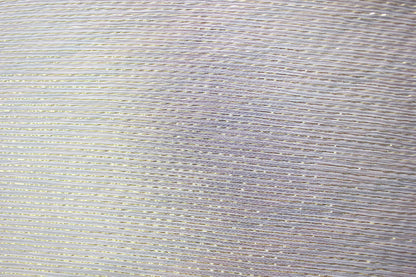 Close-up of fine Yoryu crinkles and gold-tone metallic stripes woven through lightweight MingSilk silk fabric.