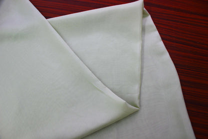 Luxury light green silk fabric draping display for premium fashion garments