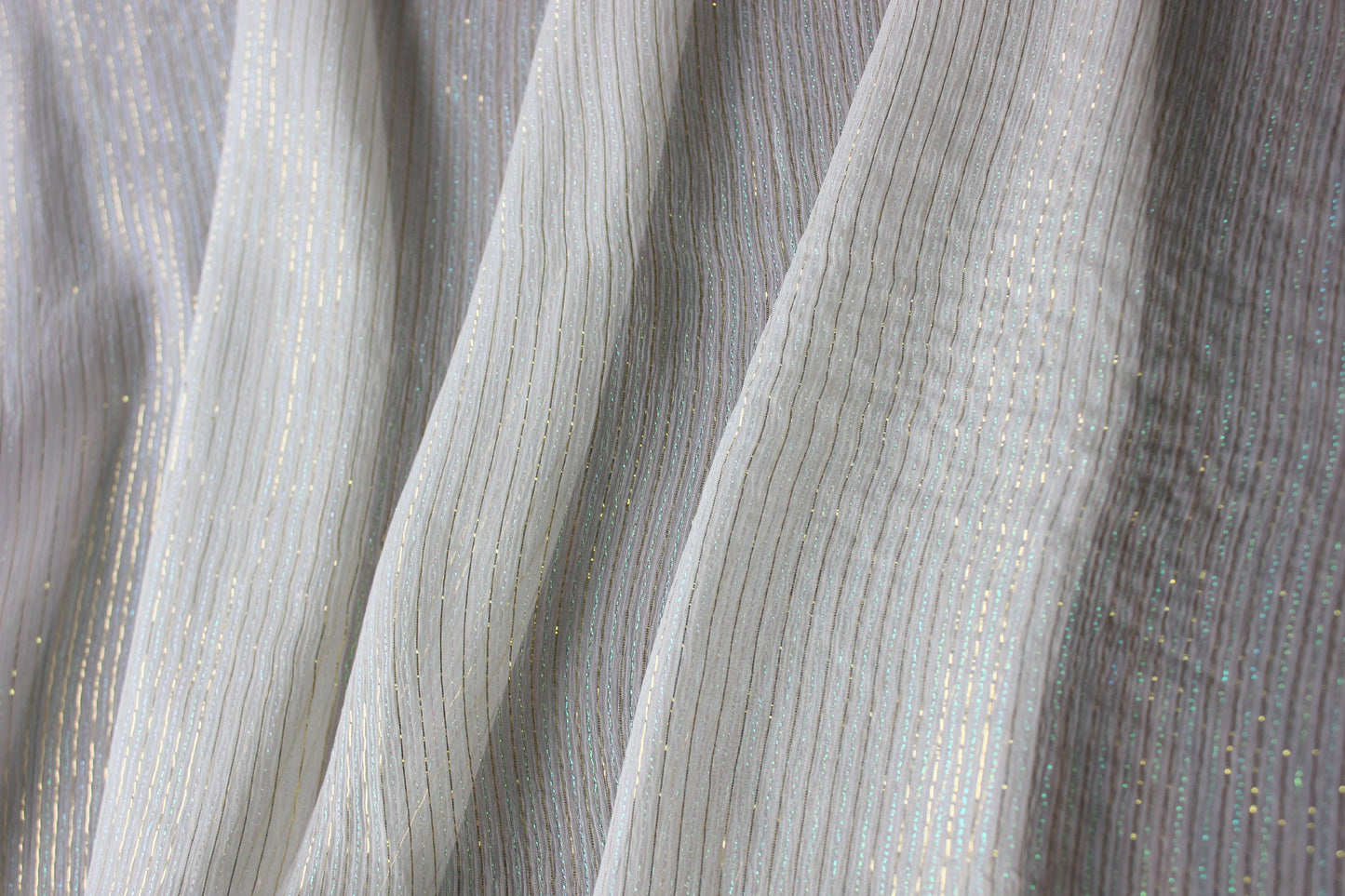 Lightweight MingSilk Yoryu silk draped vertically to show its airy movement and fluid fall.