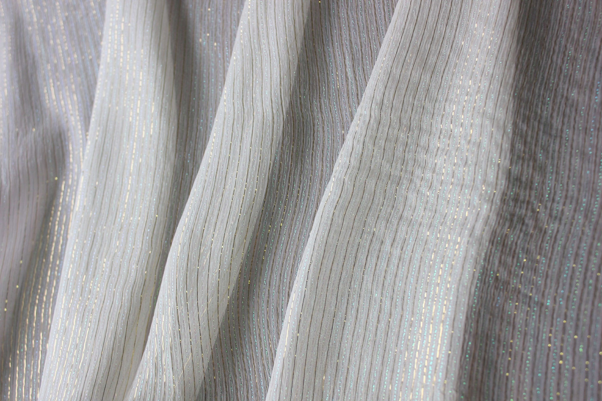 Lightweight MingSilk Yoryu silk draped vertically to show its airy movement and fluid fall.