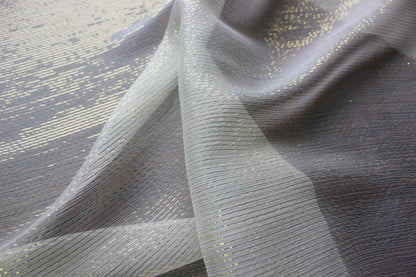 Layered sheer silk Yoryu showing transparency, fine crinkles and gold-tone metallic stripes.