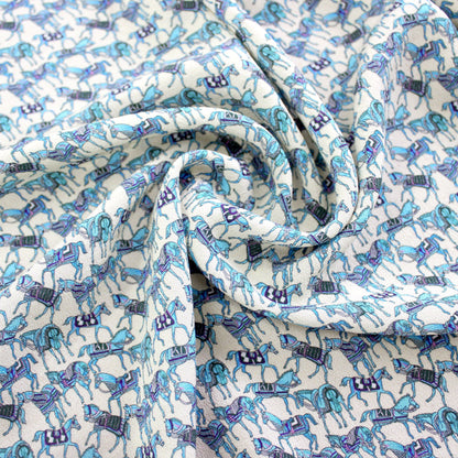 Horse motif silk crepe de chine fabric swirled to show lightweight flow